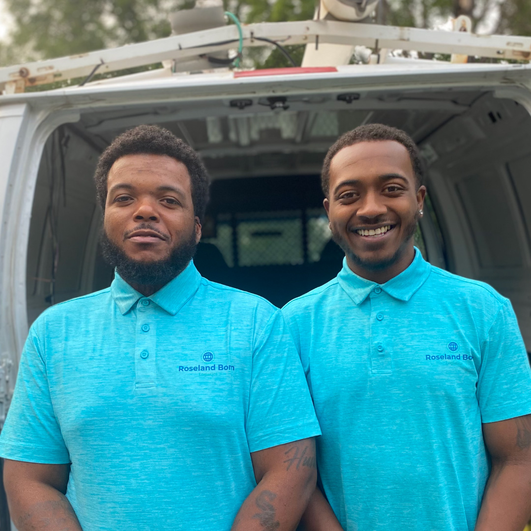 Business owners standing near truck